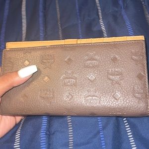 Authentic Mcm wallet brown womens in almost new condition no tears rip anything